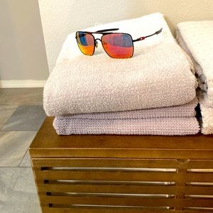 Oakley Deviation sunglasses with reflective lenses.